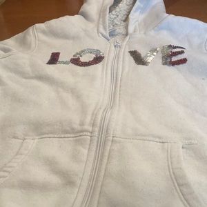 Old Navy, zip up sweater with flips on front and fluffy inside.